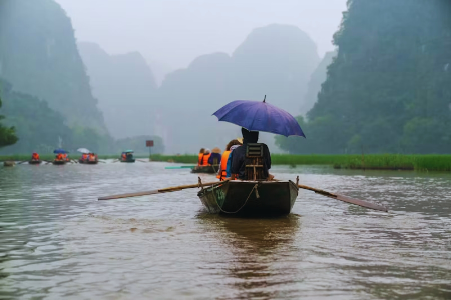 Vietnam solo travel on a traditional boat ride in Ninh Binh